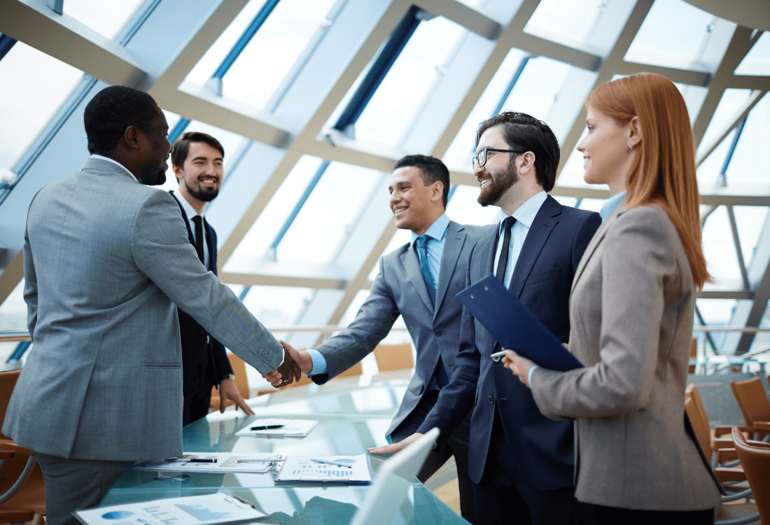 two people shaking hands representing the skills needed for negotiation 